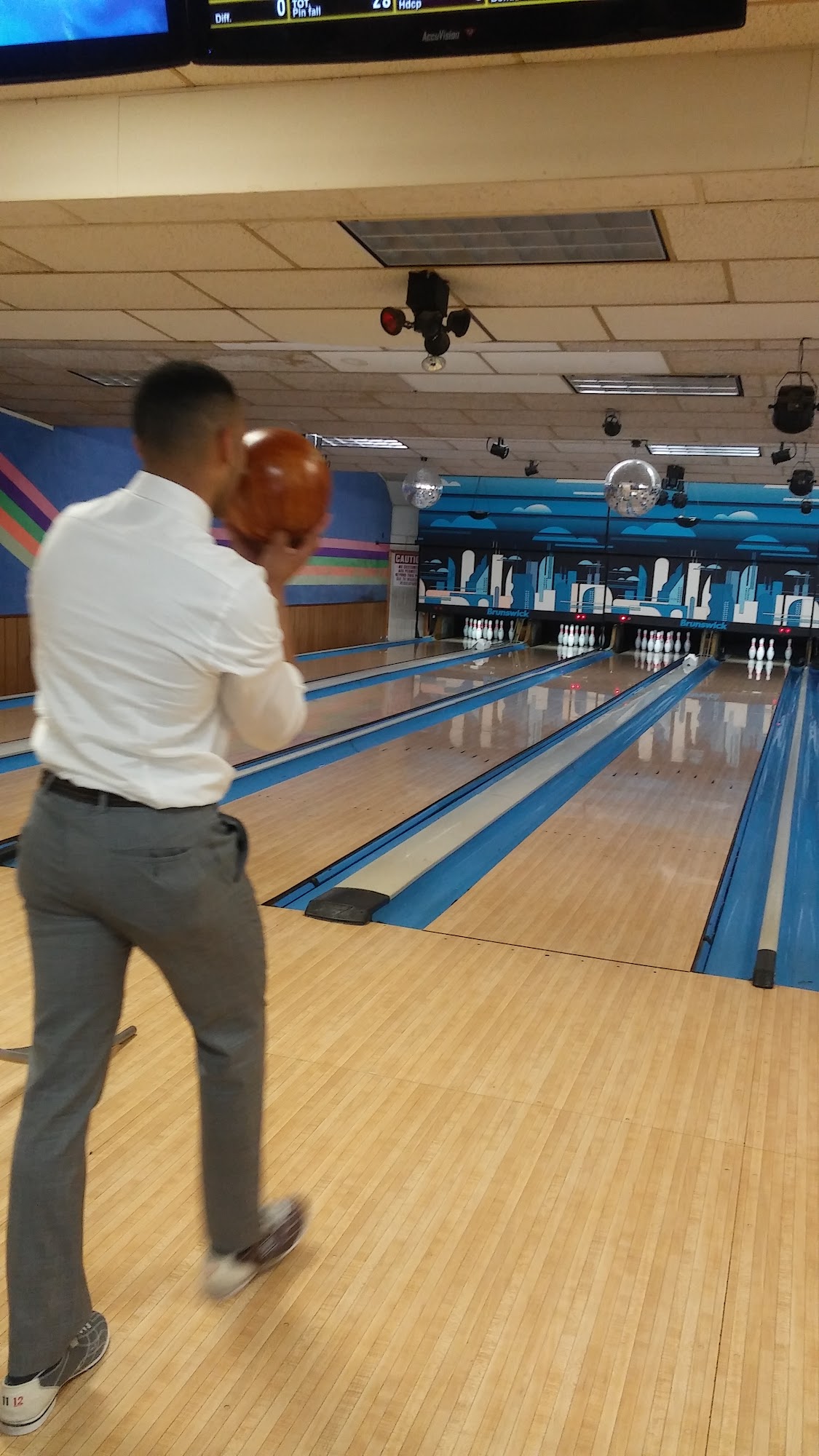 Coworkers enjoying a corporate bowling event