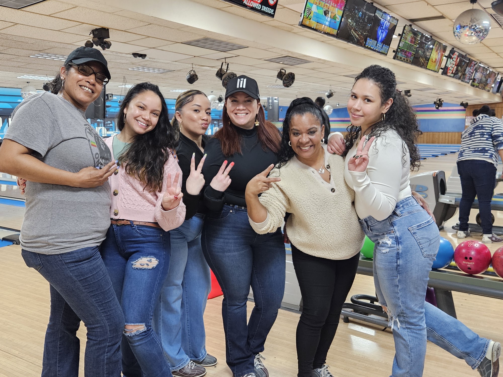 Family enjoying bowling together at Bowlerland